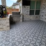 Beautiful ceramic tile installed over concrete patio.