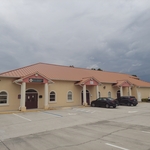 Before picture of the commercial building with a Tile roof.