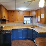 Full kitchen and new flooring; the client decided to keep the original upper cabinets