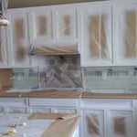 Masked, primed, and finish applied