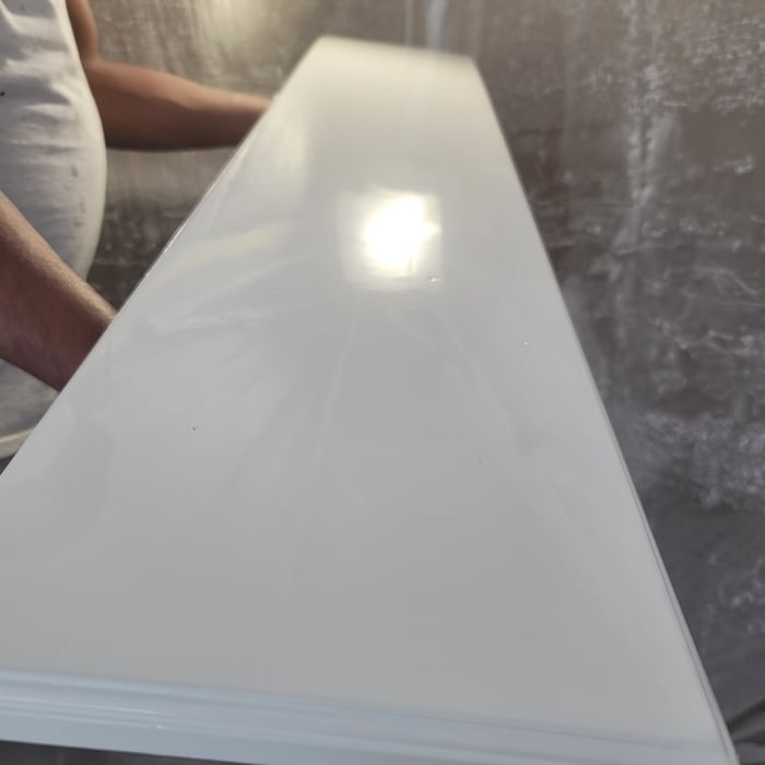 Primed and 2 coats of lacquer precatalized product
Satin finish, image is when it was wet