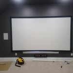 This is the left front in wall speaker and the center channel below the screen.