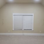 The room was not pre-wired for any video or audio. We ran speaker wire behind the baseboards and ran behind the walls for complete concealment.
