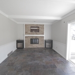 Painting of walls, ceiling, beams, trim, and doors.