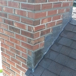 Installed new lead flashing and minor repointing completed.