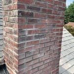 This chimney was done from the roof up as contracted. Some of the mortar joints are still wet which you can see by the darker spots.