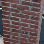 This is the 2nd chimney which we were only con
tracted to spot point any cracks or holes. After talking to my foreman, we decided it was best for us to point the whole chimney from the roof to the top and not charge the customer any additional money!!!