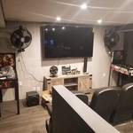 Tile wall and floor with 75 inch TV mounted