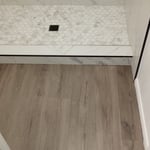 LVP floor in bathroom and custom tile shower