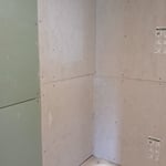 A different view of bathtub/ shower after new green board and backer board was installed.