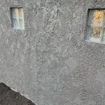 Existing stucco wall repaired and painted.