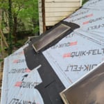 skylight flashing being replaced, and well protected from leakage, and of course new shingles.