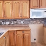 Just look at that lovely backsplash! This was Shane's very first job with us.
