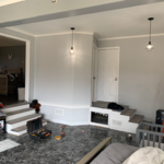 Convert garage to full function apartment, Build full shower, connected to existing half bath, and open up other wall to access bedroom