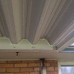 Sparrows Roosting Under Awning