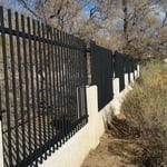 Fence line mounted into the block at the bottom and welded together up top off the posts that we mounted to the pylons