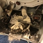 Dryer before cleaning. You can see the burnt lint throughout bottom of dryer