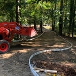Excavated driveway with crushed concrete base.