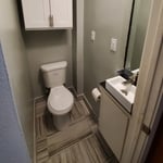 A functional sink was installed that did not come out into the doorway. A custom cabinet needed to be built for the plumbing.