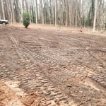 Grade finished with top soil mixed in to the red clay