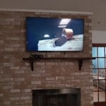 Complete wire concealment and 55 inch tv wallhang on brick.