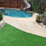We installed the small section of synthetic grass beside the pool. It was an area that would not grow natural grass. This photo shows grass that is made for animals. It is short and very durable.