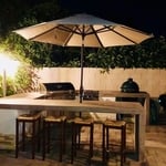 Full outdoor kitchen for a professional chef. Custom concrete countertops with eating space and fitted appliances