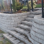 Built reataning Wall and a small step walkway made of blocks. AS in picture.