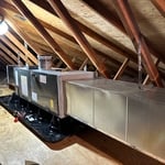 The new air handler we installed is designed to work in conjunction with the high-efficiency condenser unit to provide optimal air flow and temperature control for the home. It has been designed to be a reliable and efficient component of the HVAC system. The air handler is equipped with a high-efficiency blower motor that can help increase the unit's efficiency and reduce energy consumption. Additionally, the air handler has been designed with a multi-speed fan that can provide improved air fl