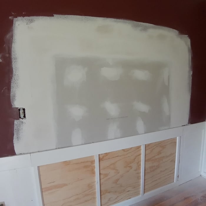 Closed in case opening to living room and installed wainscoat