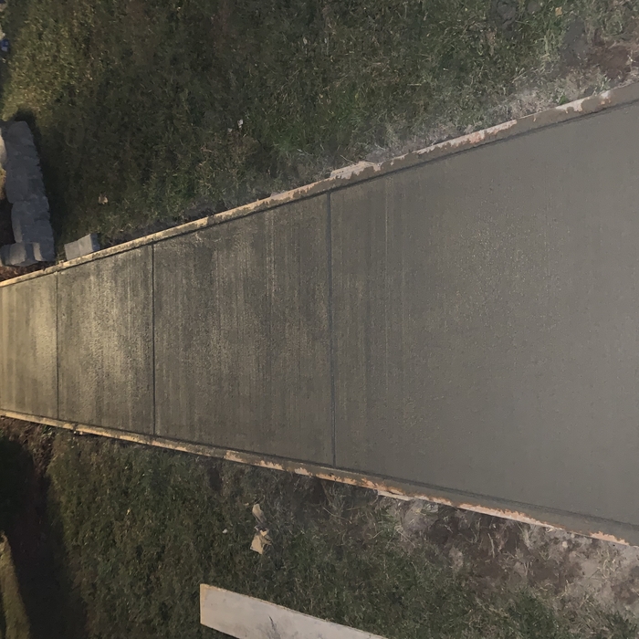 Concrete walkway and retaining wall