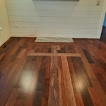 Ipe Flooring with dark walnut cross inlay.