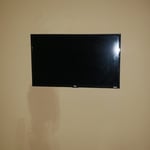 32 inch mounted on a full motion bracket. Setup for use with streaming apps.