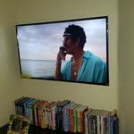 42 inch mounted on a flat bracket. Setup for use with cable and streaming apps.