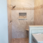 Guest bathroom rip up of tile replaced with stone