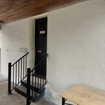 Opposite wall on car porch leading into home
