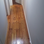 Hardwood floor we refinished. 3 coats of water based poly (gloss) we applied.