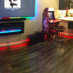 Installed fireplace, LEDs around trim of the walls and around the 85 inch tv