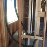 Plumbing manifold for tank type water heater and softener loop.