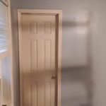 Bathroom Door rehung and trimmed out, other finished and painted wall.