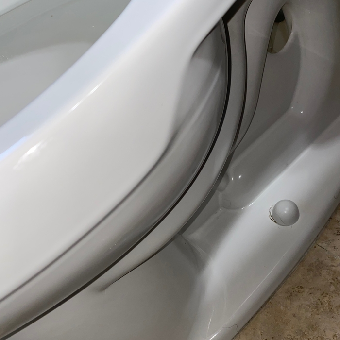 Cleaned side of toilet in bathroom