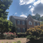 Two-story home with removal of Satelite dish