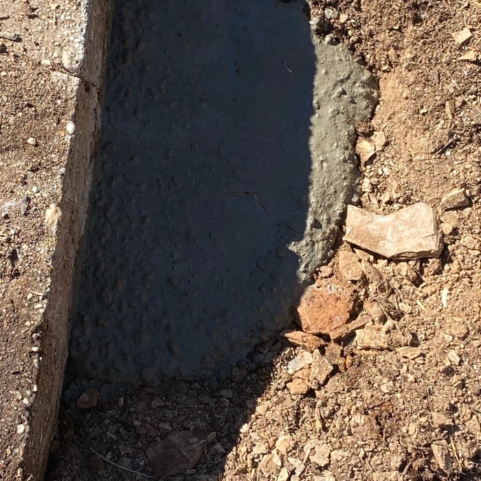Repaired septic tank wall and secured Leech line T