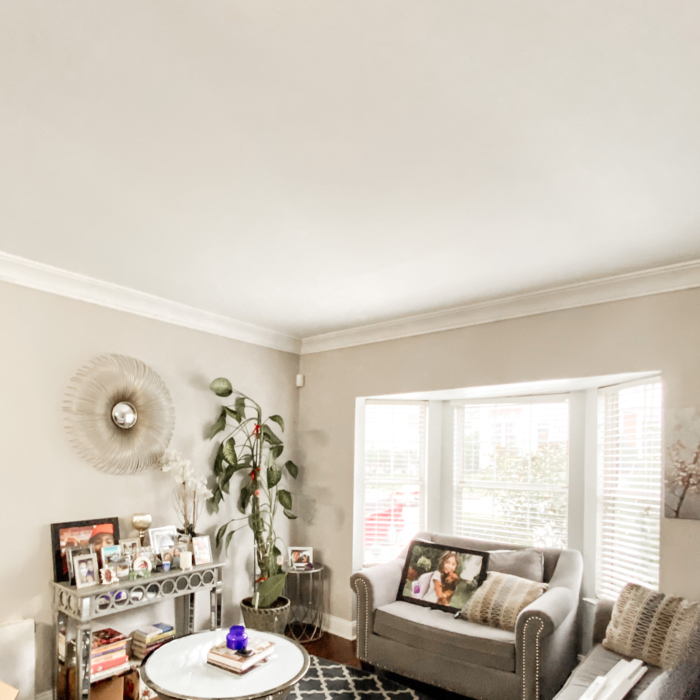 Full perpective view of our clients master living room 3 level crown moulding install.