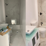 We scrubbed the bath tub and clean all backsplash tiles. Disinfected tub, toilet and bathroom sink . Cleaned and steamed the floors