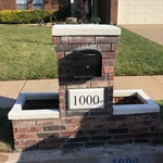 Rebuilt Mailbox with side planters and locking box. Drains in the bottom and matched bricks with the house.