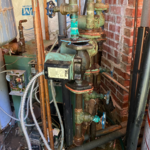 Very old oil fired hot water boiler heating system