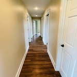 New paint, flooring, trim, and painted doors.
