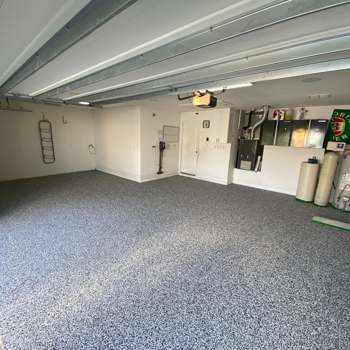 Finished garage after our three part epoxy flake flooring was applied to perfection.