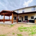 This cedar patio cover spans the full length of the home it was attached to and extends 18 ft from the house where the gable roof was built/